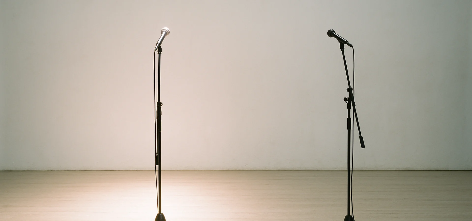 Is there an Oingo Boingo reunion — two empty microphone stands on a bare theatre stage, one lit, one not